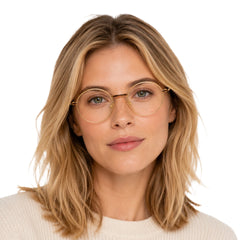 Woman wearing OS GLADIATOR 10002 oval round metal prescription eyeglasses for men and women in brown and gold, front view