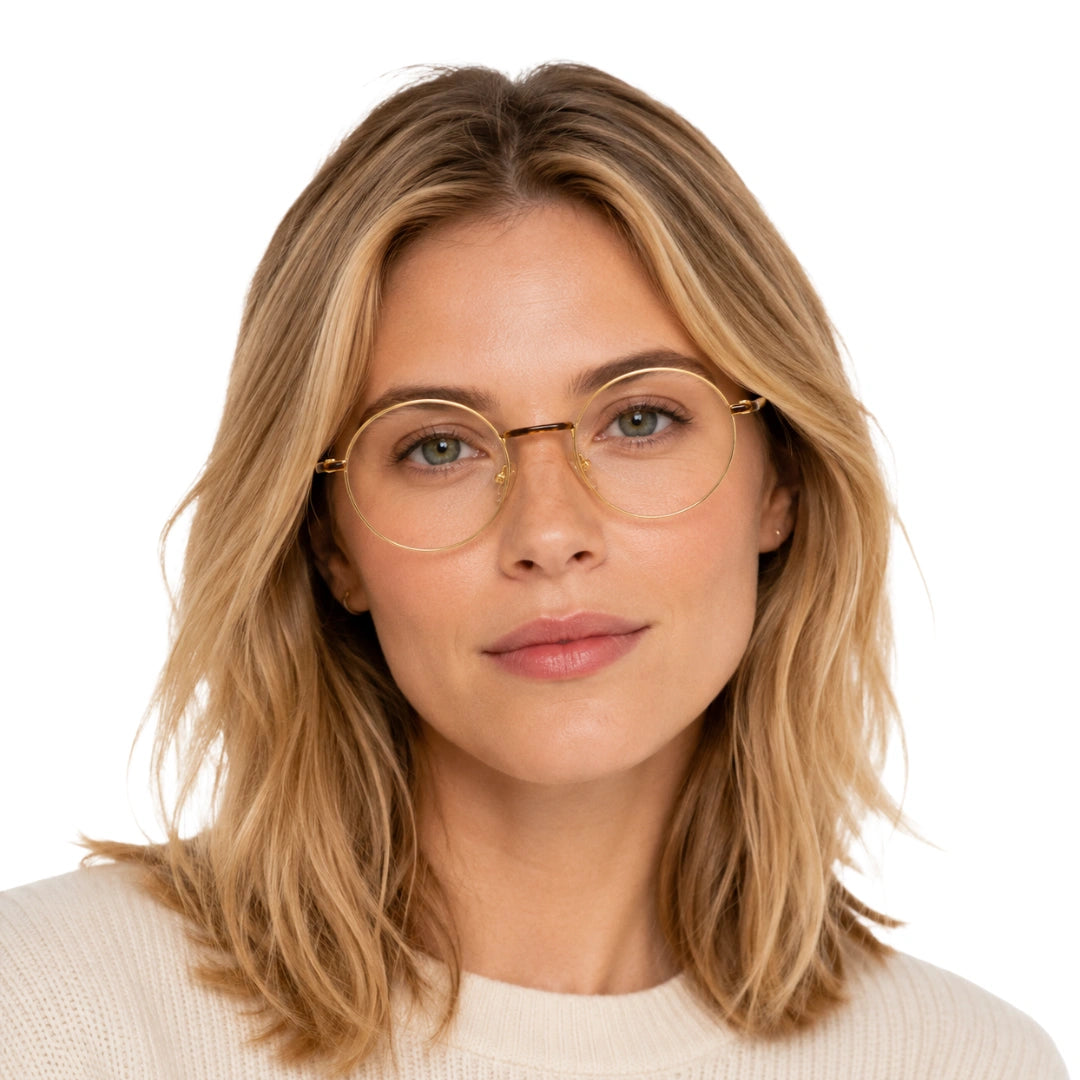 Woman wearing OS GLADIATOR 10002 oval round metal prescription eyeglasses for men and women in brown and gold, front view