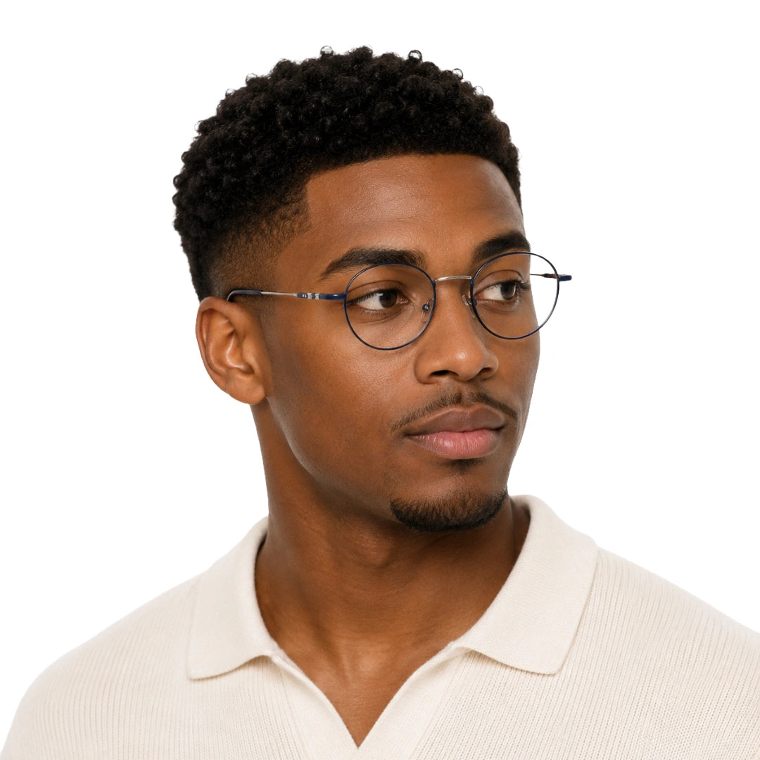 Man wearing OS GLADIATOR 10002 oval round metal prescription eyeglasses for men and women in silver and blue