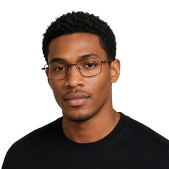 Man wearing OS PrismX 75101 rectangular full-rim metal eyeglasses in brown, front view
