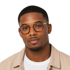 Man wearing OS Slomga 31004 modern square double bridge eyeglasses in brown and gold, front view