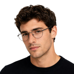 Man wearing OS Solitude 15107 classic round metal prescription eyeglasses in gunmetal and black, front view
