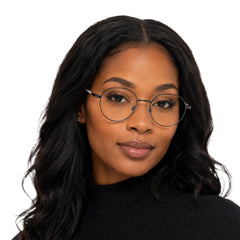 Woman wearing OS Solitude 15107 classic round metal prescription eyeglasses in gunmetal and white, front view